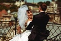 Groom whirls a bride on the roof with a great cityscape of Lviv Royalty Free Stock Photo