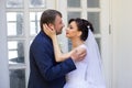 Groom in white shirt kissing bride hand. Very gentle photo Royalty Free Stock Photo