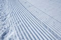 Groomed ski run track in snow