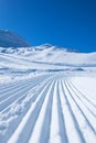 Groomed ski run track in snow