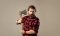 Grooming of real man. handsome hipster with axe. logger or axeman concept