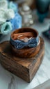 Grooms details rings in wooden box on heart shaped stand