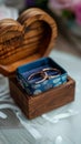 Grooms details rings in wooden box on heart shaped stand