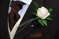 Grooms flower and cravat.