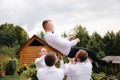 Stylish groomsman with groom standing on the backyard and prepare for the wedding ceremony. Friend spend time together