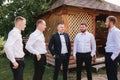 Groomsman spend time with groom at the backyard. Guys laugh and have fun