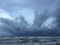 Groomy dark cloudy sky over the sea Royalty Free Stock Photo
