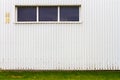 Grooved metal wall with a window