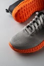 Grooved orange sole sneakers with gray elastic laces