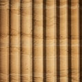 Grooved sandstone wall displaying vertical fluting reminiscent of classical architectu Royalty Free Stock Photo