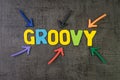 Groovy modern programming language for software development or application concept, multi color arrows pointing to the word Groovy Royalty Free Stock Photo