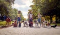 Grop of friends and dog walkers working together