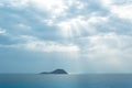 Grosa Island Silhouette Iluminated by sun ray through the clouds