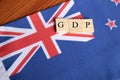 Gross Domestic product or GDP of Australia In wooden block letters on Australian Flag Royalty Free Stock Photo