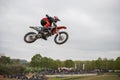 Gross Schwiesow, Germany - March 01,2019 - Motocross racer making a stunt and jumps in the air over a sand hill