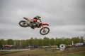Gross Schwiesow, Germany - March 01,2019 - Motocross racer making a stunt and jumps in the air over a sand hill