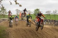 Gross Schwiesow, Germany - March 01,2019 - Motocross racers jump over a sand hill.