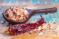 Gross sea salt mixed with dried red hot chili pepper, colorful seasoning close-up Royalty Free Stock Photo