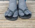 Gross - wearing toe socks in flip flops or jandals Royalty Free Stock Photo