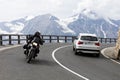 Grossglockner, Austria, 23 July 2015: Alpine road, motorbike and car speeding, Eastern Alps