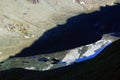 The peak of Grossglockner mountain is reflected in the water collected from the melting Pasterze glacier. Royalty Free Stock Photo