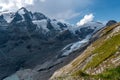 Grossglockner mountain lake rocks and yellow flowers in the foreground in the Austrian Alps in the Hohe Tauern mountains Royalty Free Stock Photo