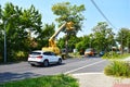 Closed road with a lift and workers for tree trimming and tree care work