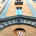 Grotesque mask, windows, wall, architecture, art and beauty Royalty Free Stock Photo