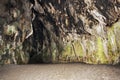 Inside a large cave in limestone crock on the beach. Grotto.