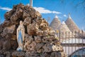 Grotto and traditional Trulli. Alberobello. Apulia. Italy Royalty Free Stock Photo