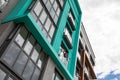 Ground angular view of dwelling house against cloudy sky