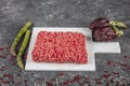 Ground beef. Fresh Raw mince, Minced beef, ground meat with herbs and spices on black plate Royalty Free Stock Photo