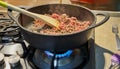 Ground beef is fried in spaghetti bolognese pan according to recipe from the Internet Royalty Free Stock Photo