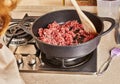 Ground beef is fried in spaghetti bolognese pan according to recipe from the Internet Royalty Free Stock Photo