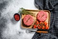 The ground beef patties, minced meat cutlets. Gray background. Top view Royalty Free Stock Photo