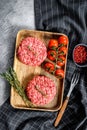 The ground beef patties, minced meat cutlets. Gray background. Top view Royalty Free Stock Photo