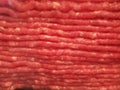 Ground beef raw in the package closeup