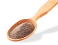 Ground black pepper in a wooden spoon on a white background. Isolated Royalty Free Stock Photo