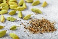 Ground cardamom seeds and whole pods close-up Royalty Free Stock Photo