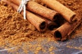 Ground cinnamon, cinnamon sticks, tied with jute rope and cinnamon powder in rustic style Royalty Free Stock Photo