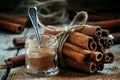 Ground cinnamon, cinnamon sticks, tied with jute rope on old woo Royalty Free Stock Photo