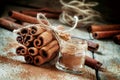 Ground cinnamon, cinnamon sticks, tied with jute rope on old woo Royalty Free Stock Photo