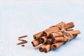 Ground cinnamon, sticks, tied with jute rope on old wooden background, selective focus, space for text, instagram filter Royalty Free Stock Photo