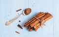 Ground cinnamon, sticks, tied with jute rope on old wooden background, selective focus, space for text, instagram filter Royalty Free Stock Photo