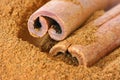 Ground cinnamon and whole sticks Royalty Free Stock Photo