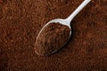 Ground coffee background. Ground Coffee with spoon close-up Royalty Free Stock Photo