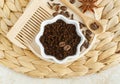 Ground coffee beans for preparing homemade exfoliating coffee and spice scrub. Natural beauty treatment and spa recipe.