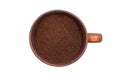 Ground coffee in coffee cup isolated on white. Top view Royalty Free Stock Photo