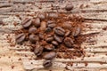 Ground coffee and grain on wood Royalty Free Stock Photo