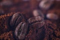 Ground coffee and grains macro shot. Smoke from freshly roasted coffee beans